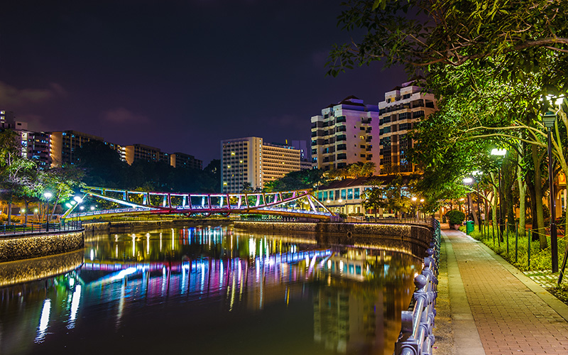 Robertson Quay street at night with light trails.