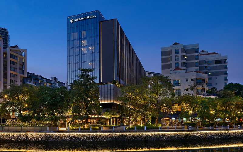 InterContinental Robertson Quay hotel exterior showing slow travel riverfront destination.