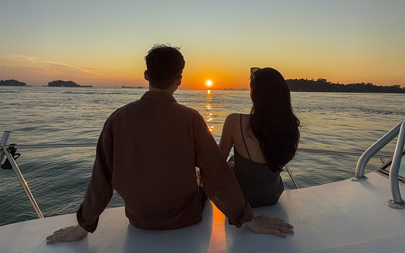 Couple enjoying a private sunset yacht proposal at Robertson Quay.